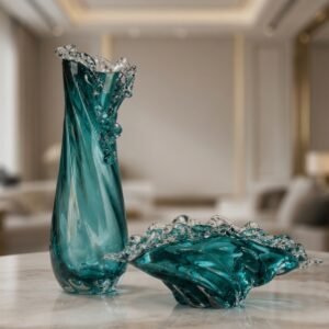 Luxury blue art glass vase and decorative bowl with flowing wave-inspired sculptural design.