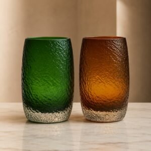 Luxury textured glass tumbler set featuring emerald green and amber artisan drinking glasses.