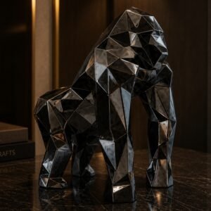 Luxury geometric gorilla sculpture with a faceted metallic finish, displayed as a contemporary decorative centerpiece in a sophisticated modern interior.