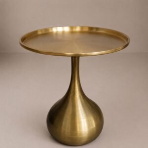 Luxury brushed brass side table with tray-style round tabletop and sculptural pedestal base.