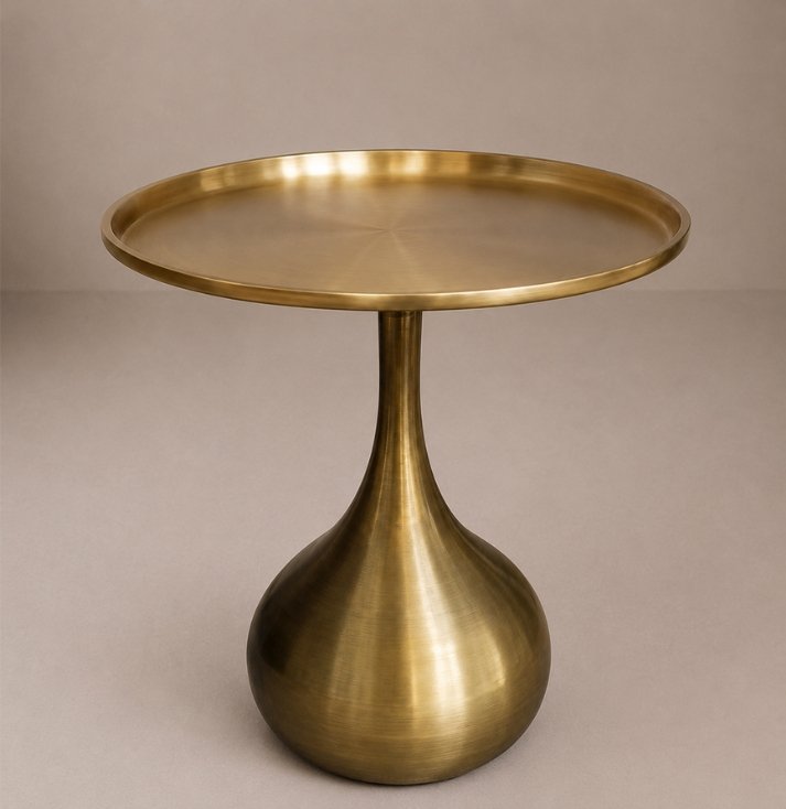 Regal Brass Pedestal Side Table Luxury brushed brass side table with tray-style round tabletop and sculptural pedestal base.