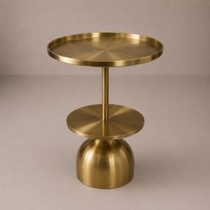 Luxury brushed gold two-tier side table with tray-style tabletop and sculptural pedestal base.