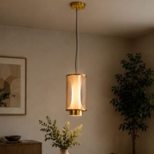 Luxury cylindrical glass pendant light with an illuminated sculptural inner core, brushed gold accents, and warm ambient lighting, suspended in a sophisticated contemporary interior.