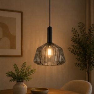 Modern smoked glass pendant light with geometric faceted shade and warm ambient illumination.