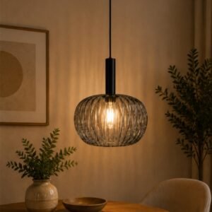 Luxury smoked glass spherical pendant light with warm ambient glow and modern black suspension.