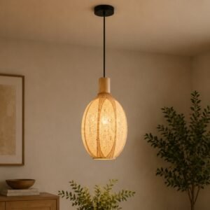 Luxury woven pendant light with an elongated rattan-inspired shade, natural wood accents, and warm ambient illumination, suspended in a modern organic interior.