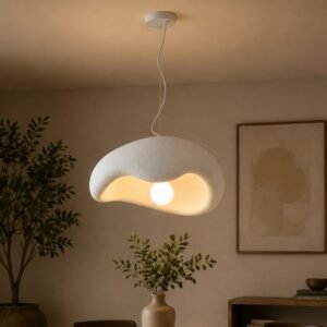 Luxury sculptural pendant light with an organic cloud-shaped design, textured matte finish, and warm ambient illumination, suspended in a contemporary minimalist interior.