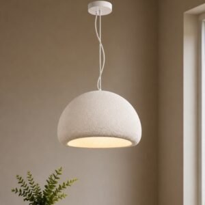 Luxury dome pendant light with a textured white finish, minimalist design, and warm ambient illumination, suspended in a contemporary modern interior.