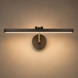 Modern linear LED picture light with brass detailing and warm ambient illumination.