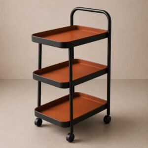 Modern three-tier rolling utility cart with a matte black metal frame, terracotta storage trays, and caster wheels, designed for stylish organization, serving, and storage in contemporary interiors.